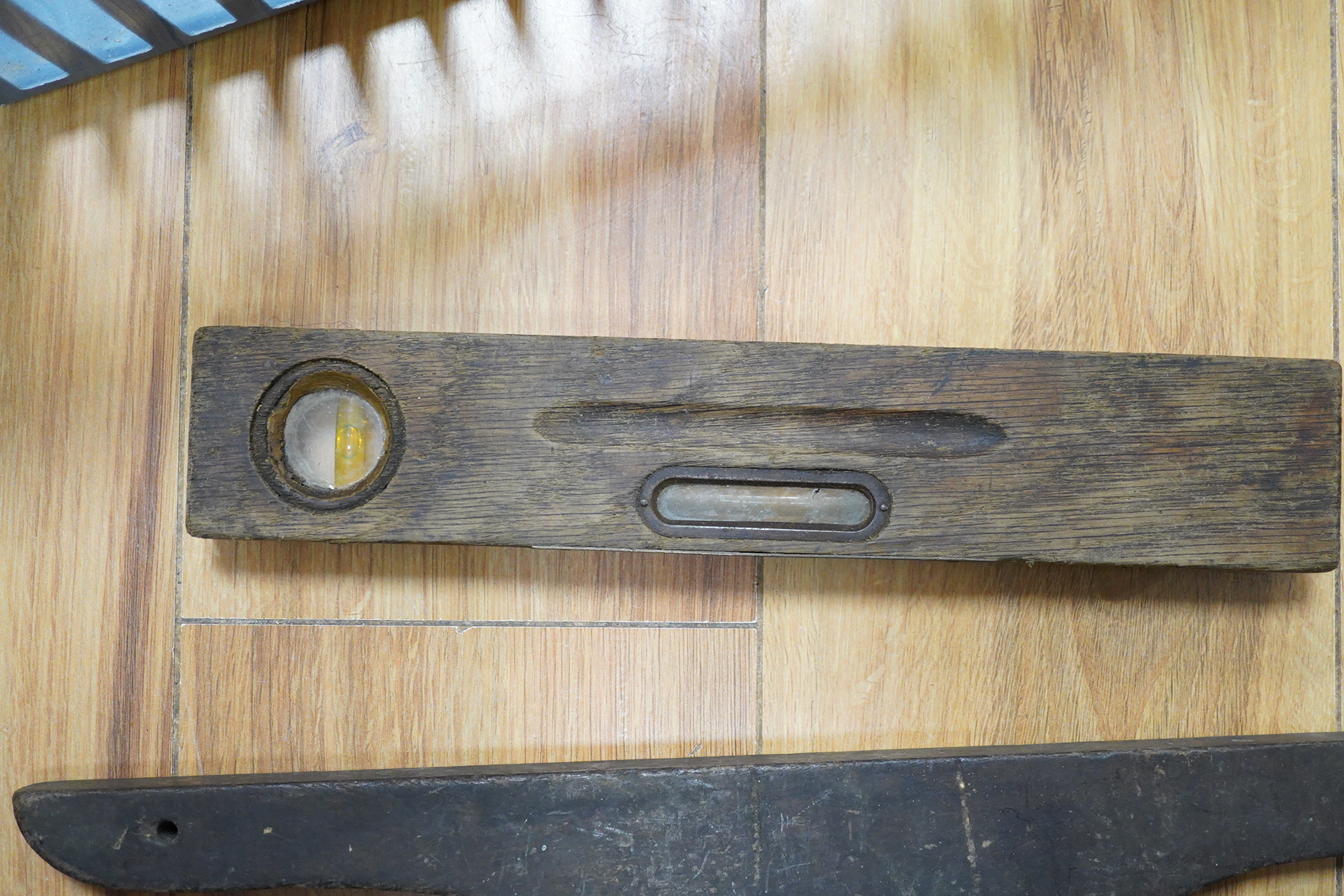 A group of levels, and an Indian knife and fork set - 43cm long